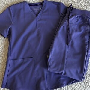Fabletics scrubs size small (pants are small short). Color is wisteria purple.